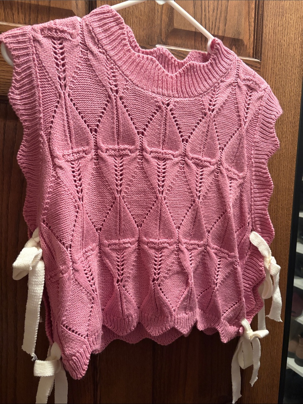 Sleeveless Pink Knit Sweater with Side Tie Details